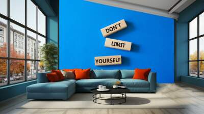 Do not limit yourself symbol. Concept words Do not limit yourself on wooden blocks. Beautiful blue background. Business and Do not limit yourself concept. Copy space Wall mural