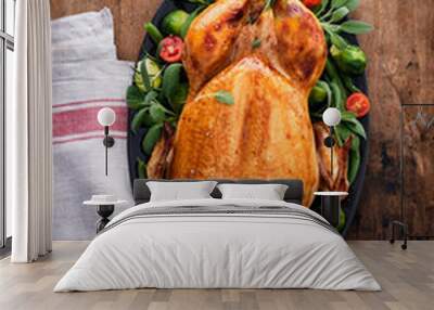 Festive celebration chicken with herbs for Thanksgiving or Christmas on wooden background. Wall mural