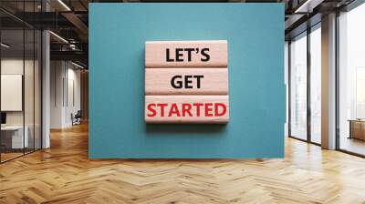 Lets get started symbol. Concept words Lets get started on wooden blocks. Beautiful grey green background. Business and Lets get started concept. Copy space. Wall mural