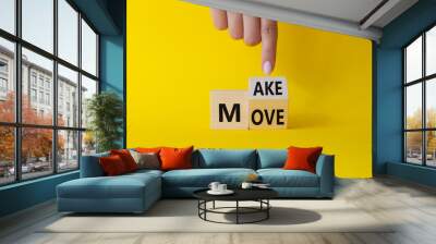 Make your Move symbol. Businessman hand points at turned wooden cubes with words Make Move. Beautiful yellow background. Business and Make your Move concept. Copy space Wall mural