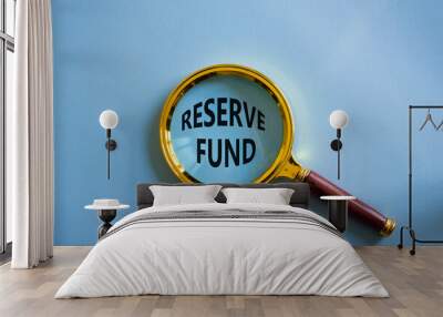 Reserve Fund symbol. Magnifying Glass with Concept word Reserve Fund. Beautiful blue background. Business and Reserve Fund concept. Copy space Wall mural