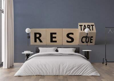 Restart Rescue symbol. Turned wooden cubes with words Rescue and Restart. Beautiful grey background. Business and Restart Rescue concept. Copy space Wall mural