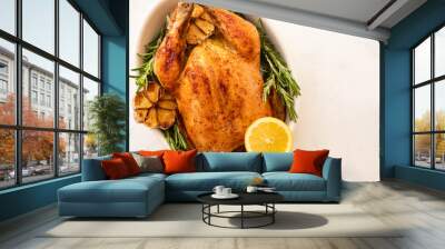 Roast chicken with lemons, garlic and rosemary for Christmas. Christmas concept. Top view. Wall mural