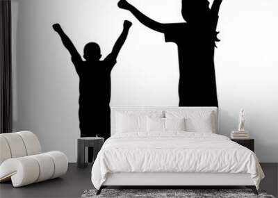 Silhouette of a woman with her son joyfully raising their hands. A happy family Wall mural