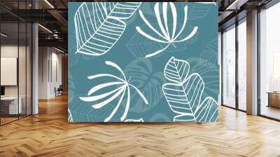 Tropical seamless pattern with leaves. White tropical leaves on blue background. Banana leaves, monstera leaves, palm leaves. Wall mural