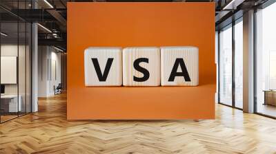 VSA - Volume Spread Analysis symbol. Wooden cubes with word VSA. Beautiful orange background. Business and Volume Spread Analysis concept. Copy space. Wall mural