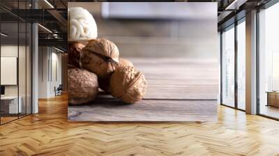 walnuts like healthy food for the brain. shape of human brain is surrounded by walnut kernels. it sy Wall mural