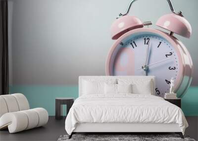 Detail close up of the old pink vintage alarm clock on colour background with free copy space. Wall mural