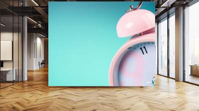 Detail close up of the old pink vintage alarm clock on colour background with free copy space. Wall mural