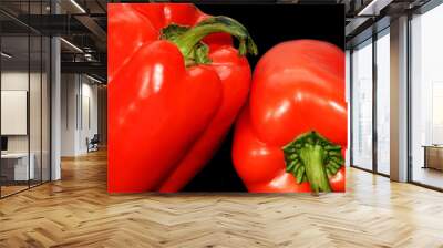 Macro. Bell pepper on black background. Two red peppers. Isolated backdrop. Closeup.  Vegetables. Organic food. Wall mural