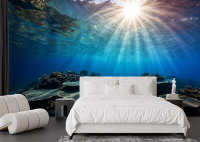 A vibrant coral reef scene with sunlight shining through the water, perfect for illustrations and designs related to marine life or tropical environments Wall mural