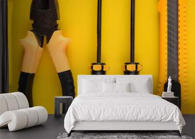 Layout of carpentry tools on a yellow background. Set of hand building tools. Equipment for the repairman. Wall mural