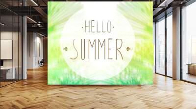 phrase Hello summer on the background of green foliage and sunlight Wall mural