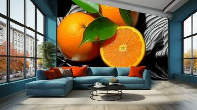 set design from oranges en green leaves, black background Wall mural