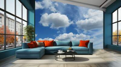 Beautiful blue sky with white fluffy clouds Wall mural