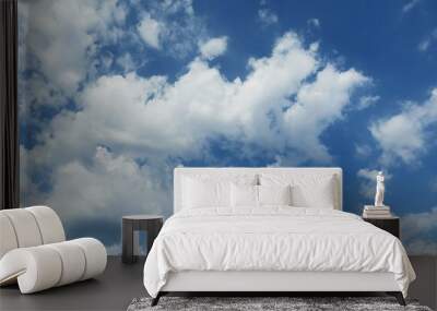 Beautiful fluffy clouds in blue sky, natural background Wall mural