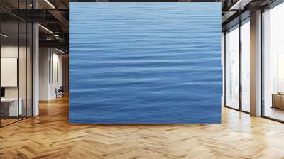 Calm surface of light blue water as a background Wall mural