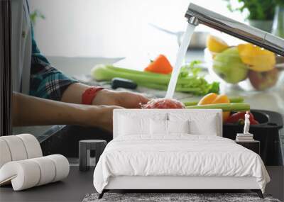 Hands woman washing vegetables. Preparation of fresh salad. Wall mural