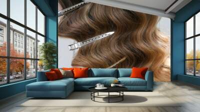 Silver hairdressers clips in wavy hair - close up  Wall mural