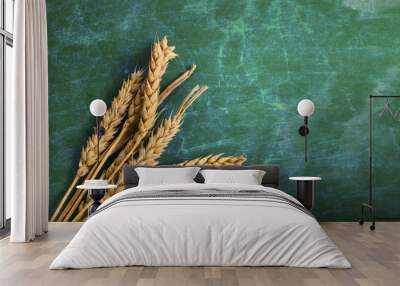 Wheat Ears on Table. Sheaf of Wheat over Wood Background. Harves Wall mural