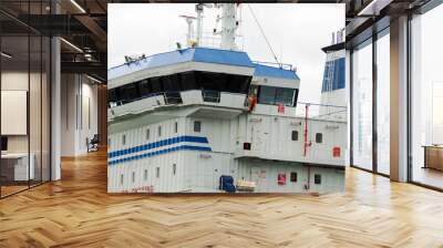 a white and blue transport vessel is close by Wall mural