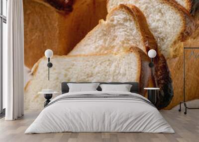 Homemade Hokkaido wheat toast bread whole and sliced on white cloth on table. Close up Wall mural