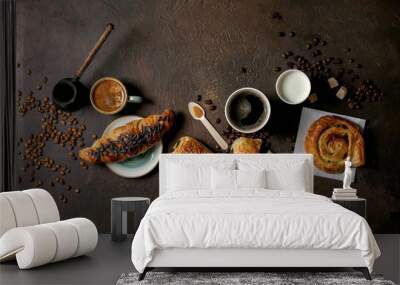 Variety of traditional french puff pastry raisin and chocolate buns, croissant with various cups of coffee and milk, cezve, recycled wooden spoon of sugar over dark texture background. Flat lay, space Wall mural