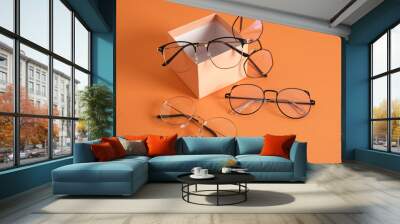 eye glasses on gift box orange background copy space Wall mural