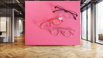 eyeglasses on bright pink background, trendy eyeglass frames copy space Wall mural