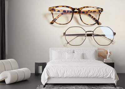 several fashionable stylish glasses on a beige background place copy top view, optics store Wall mural