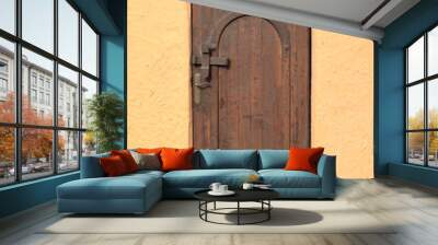 Brown wooden door with Muslim paraphernalia.Imitation of antiquity. Wall mural