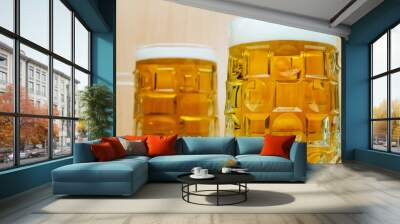 Two mugs full with beer, close-up. Wall mural