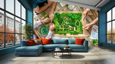 Manufacturers reviewing a blueprint for a new, eco-friendly product line that meets green and conservation standards Wall mural