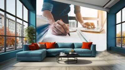 image of engineer drawing a blue print design building or house, an engineer workplace with blueprin Wall mural