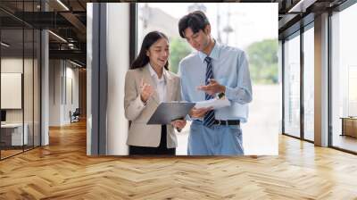 Team collaboration on business strategies by cafe window Wall mural