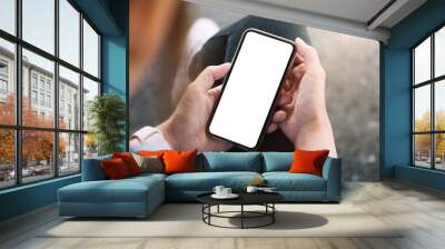 Top view Woman sitting and holding blank screen mock up mobile phone Wall mural