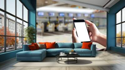 Travller using Smartphone in airport terminal. For Graphics Display Concept. Wall mural