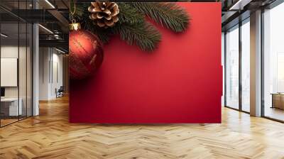 A red ornament with a gold trim sits on a red background Wall mural