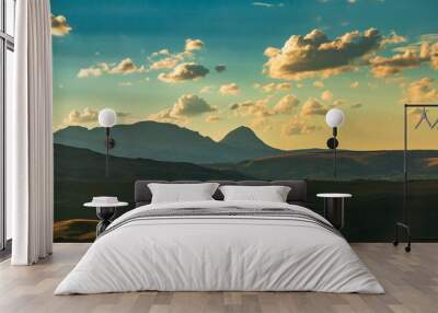 sunset in a cloudy sky on the east side of Glacier national park in Montana. Wall mural