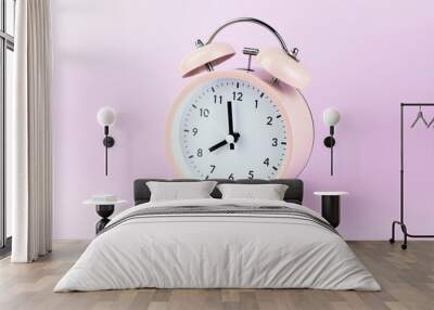 Classic Pink alarm clock on pink pastel background. Wall mural