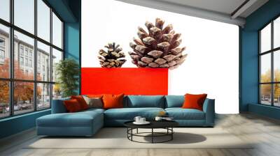 Red cube podium with pine cone on white background. Minimal Christmas holiday composition with copy space. Wall mural