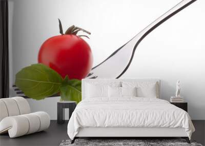 basil leaf and cherry tomato on fork isolated on white backgrou Wall mural