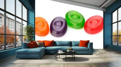 Four colorful fruit hard sugar candies,  boiled sweeties or sugar plums isolated on white background cutout Wall mural