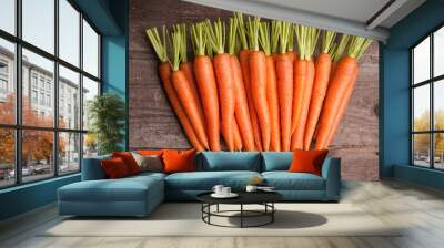 fresh carrot bunch on grungy wooden background Wall mural