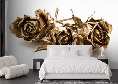 Three gold roses isolated on white background cutout. Golden dried flower heads, romance concept. Wall mural