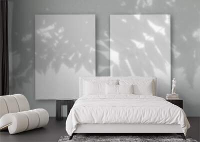 2 vertical sheets of textured white paper on soft gray table background. Mockup overlay with the plant shadows. Natural light casts shadows from an exotic plant. Horizontal orientation Wall mural