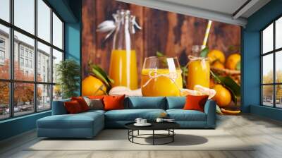 Tangerine orange juice and fresh tangerines. Healthy season organic citrus beverage.  Wall mural