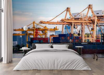 Container Cargo ship and cargo plane with working crane bridge in shipyard during sunrise,logistic import export and use for freight cargo. Wall mural