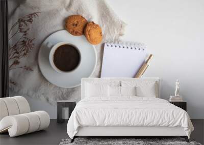 Cup of coffee with cookies and a little notepad list copy space Wall mural