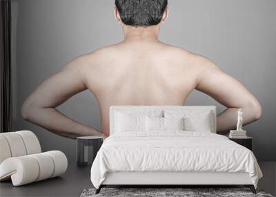 Man feeling lower back pain Wall mural